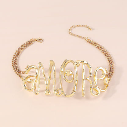 GOLD EXAGGERATED LETTER CHOKER
