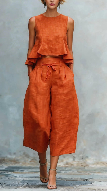 Women's two-piece linen blend set with ruffled trim.
