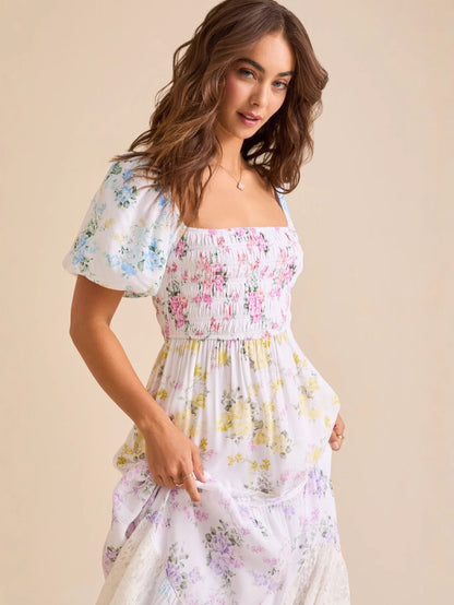 Puff-sleeved printed pleated lace strapless maxi dress